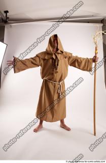 09 2019 01 JOEL ADAMSON MONK STANDING POSE WITH A…